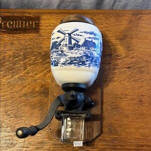 Vintage Wall-Mounted Coffee Grinder with Blue Windmill Design